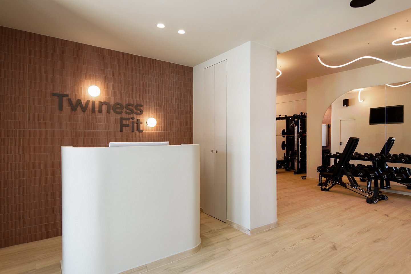 fitness architecture,sifnos gym design,boutique gym interior,cycladic architecture,commercial fitness space,natural materials design,organic lighting design,gym under construction,fitness club 2025,greek island architecture,earth tone interior,curved forms design,led ceiling feature,serene gym design,modern cycladic style,Sifnos,Commercial