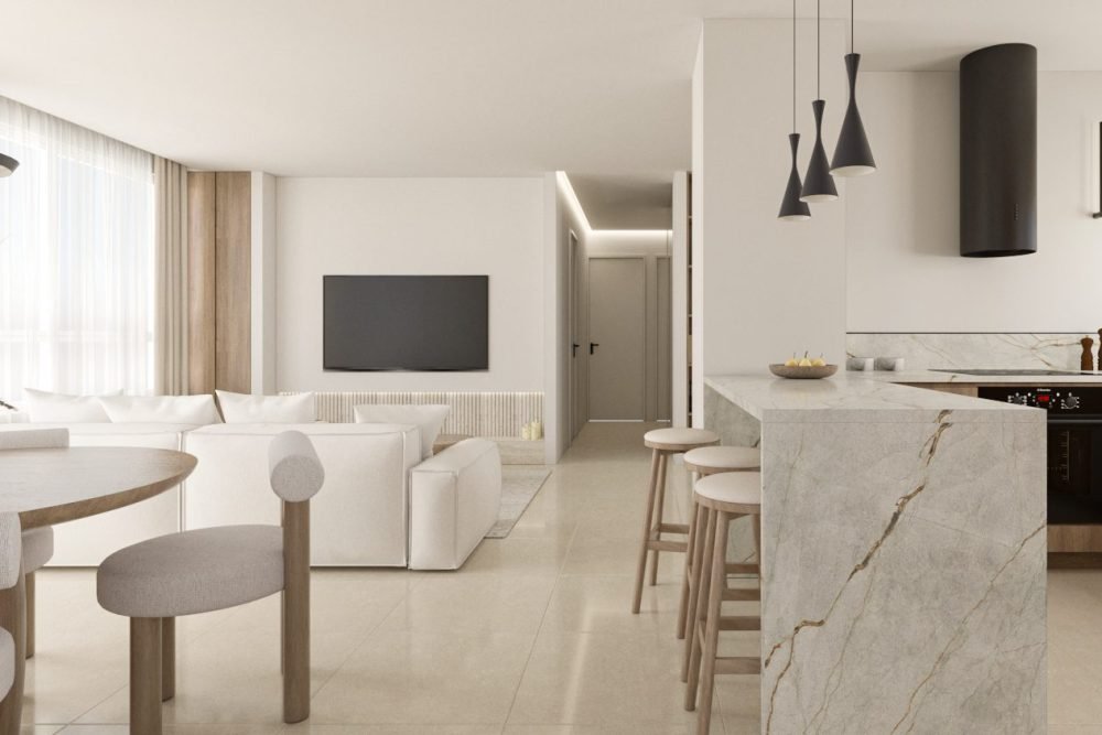 open kitchen connected to an all white living room